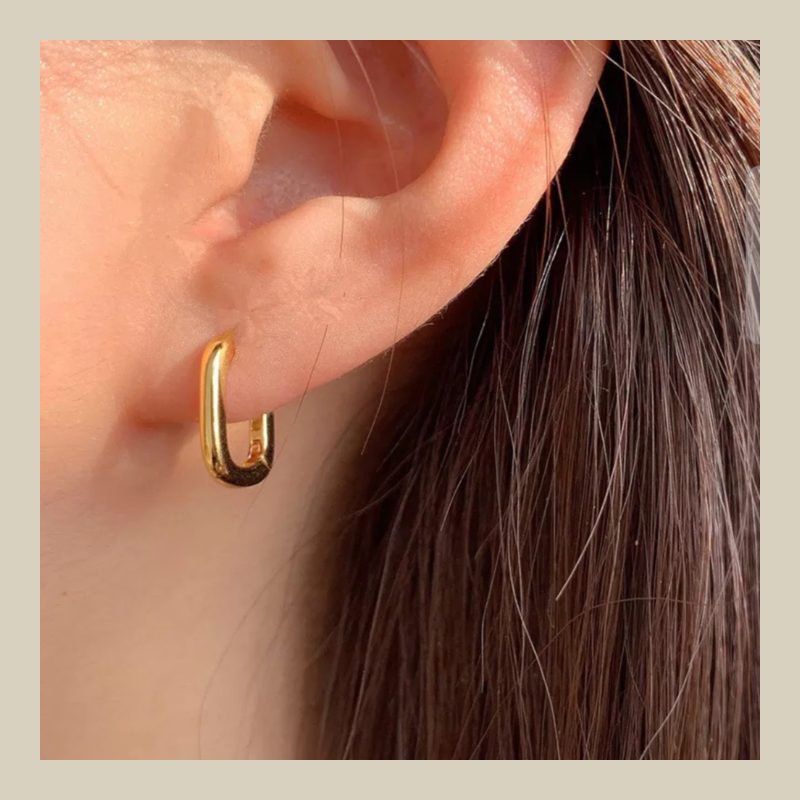Large Golden Polished oval hoop earrings.